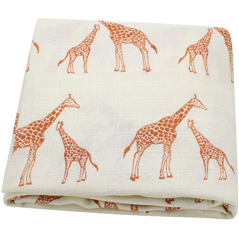 giraffe pattern organic muslin swaddle perfect for camping and travel—portable, breathable and gentle on baby’s skin 