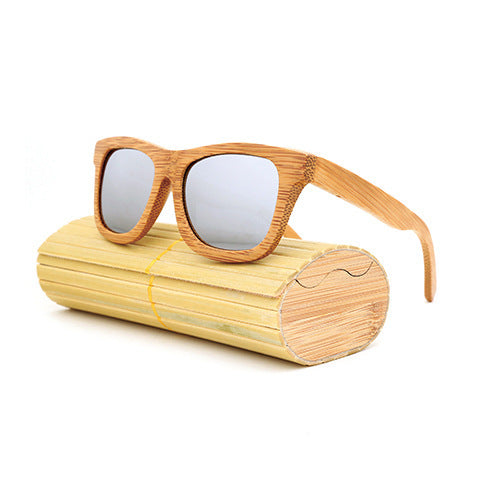 Wooden sunglasses with a matching case on a white background