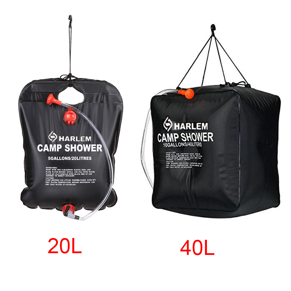Two black camp shower bag filled with water New Zealand trip