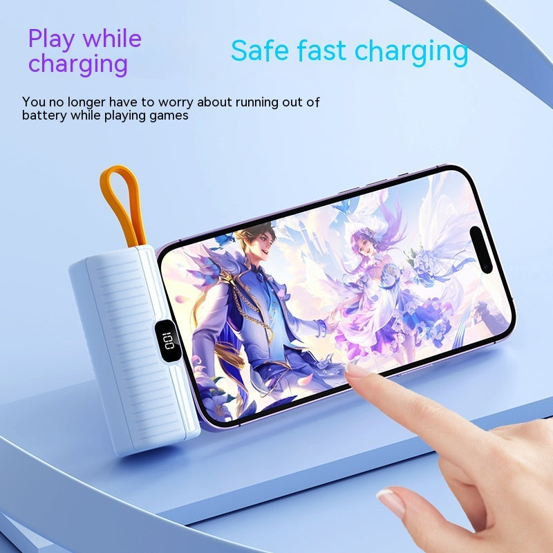 Phone with game on screen next to portable charger, text about charging and safety.