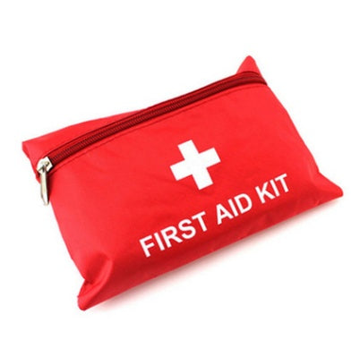 compact first aid kit packed with bandages & gloves outdoors