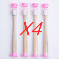 Four toothbrushes with pink bristles and handles on a white background