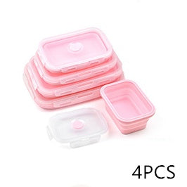 Set of pink food storage containers with lids on a white background