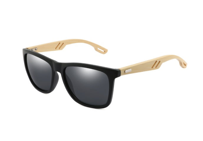 Sunglasses with black frames and gold accents on a white background