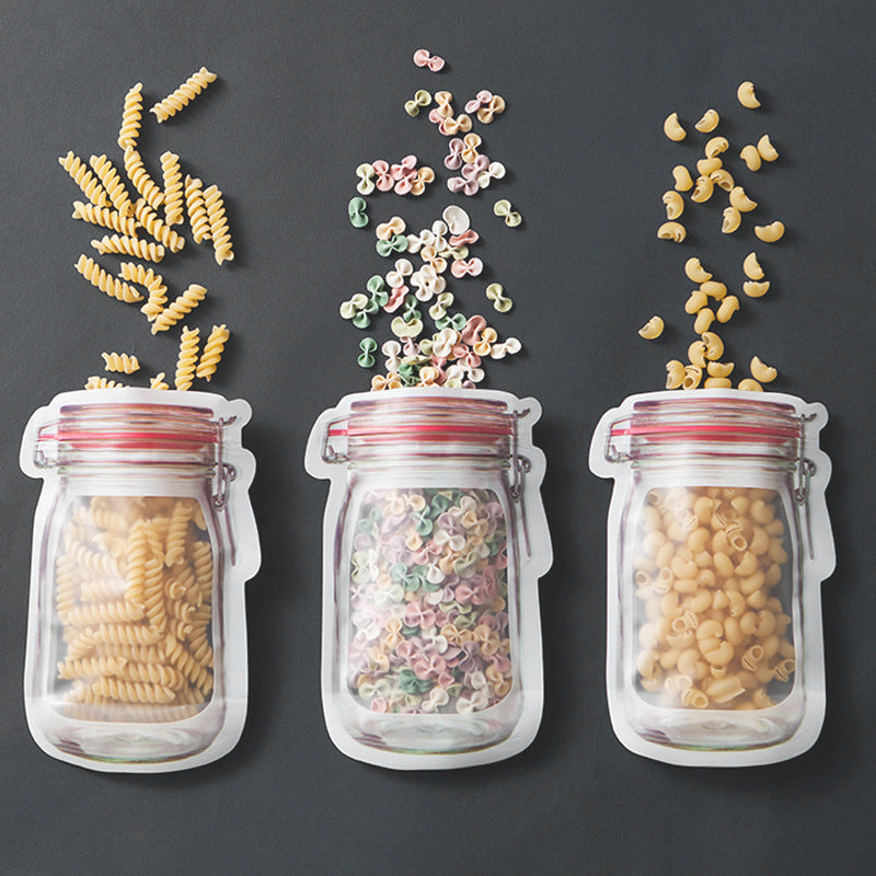 reusable snack storage bag filled with different types of pasta against a dark background.