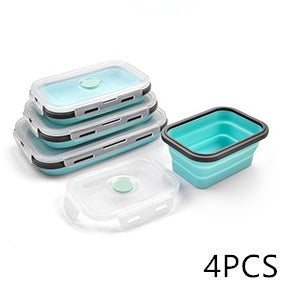Set of four silicone food containers with lids on a white background
