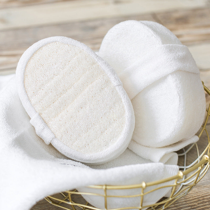 Bathroom scene with natural loofah sponge by sink—biodegradable, US bath accessory .