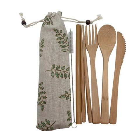 Bamboo utensils set with a carrying bag on a white background