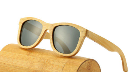 Wooden sunglasses with a matching wooden case on a white background