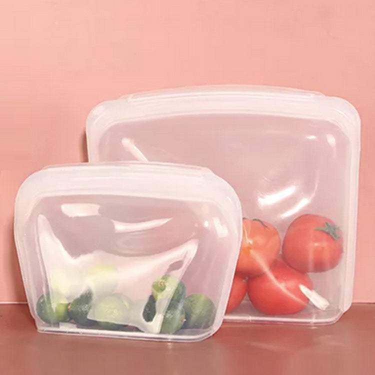 Set of reusable silicone food storage bags with vegetables on a pink background